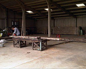 Dean checking a joist before cutting into re-sawn